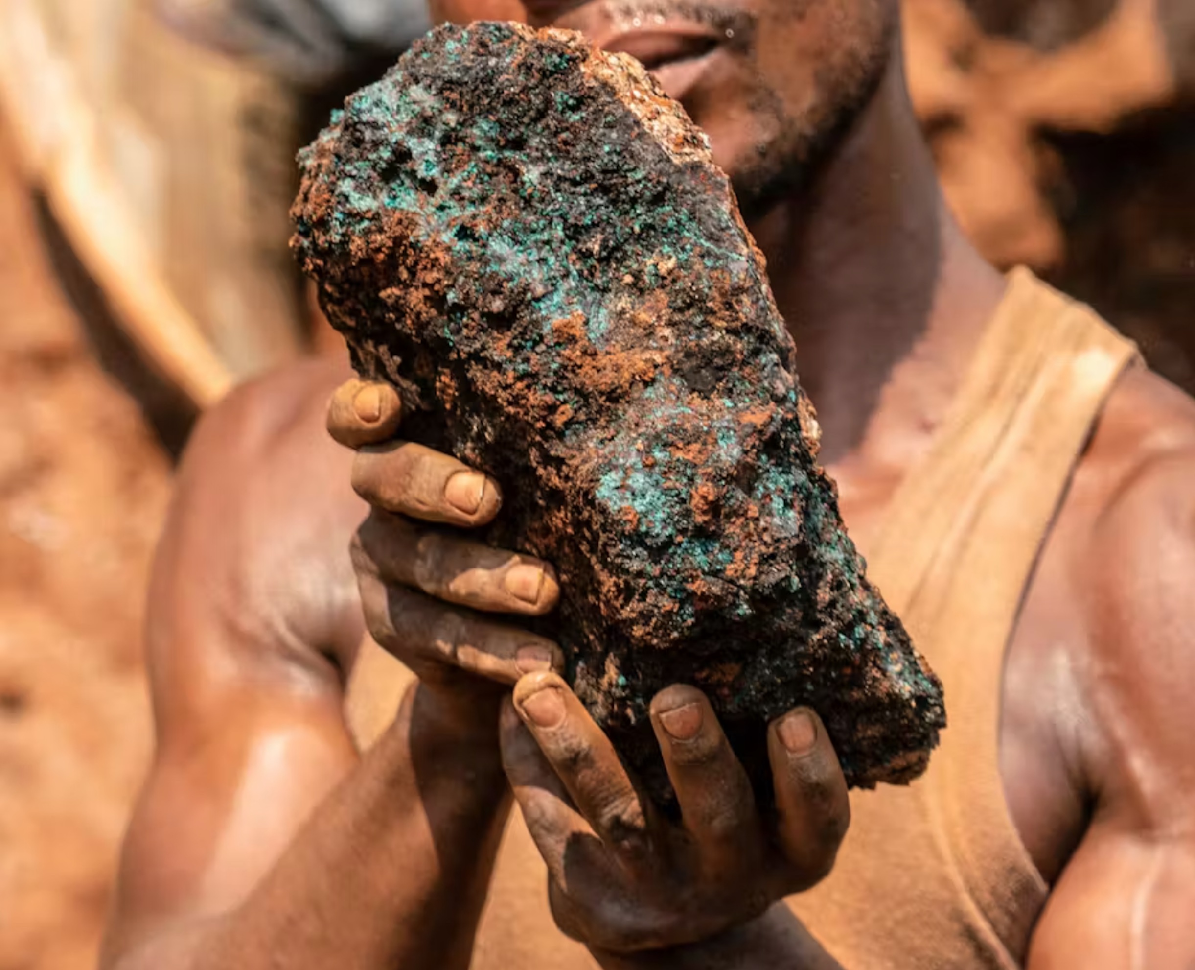 An artisanal miner holds a cobalt stone at the Shabara artisanal mine near Kolwezi.