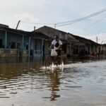 A man cycles through a flooded street as Hurricane Milton approaches the Cuban coast in Batabano, Cuba, October 8, 2024.