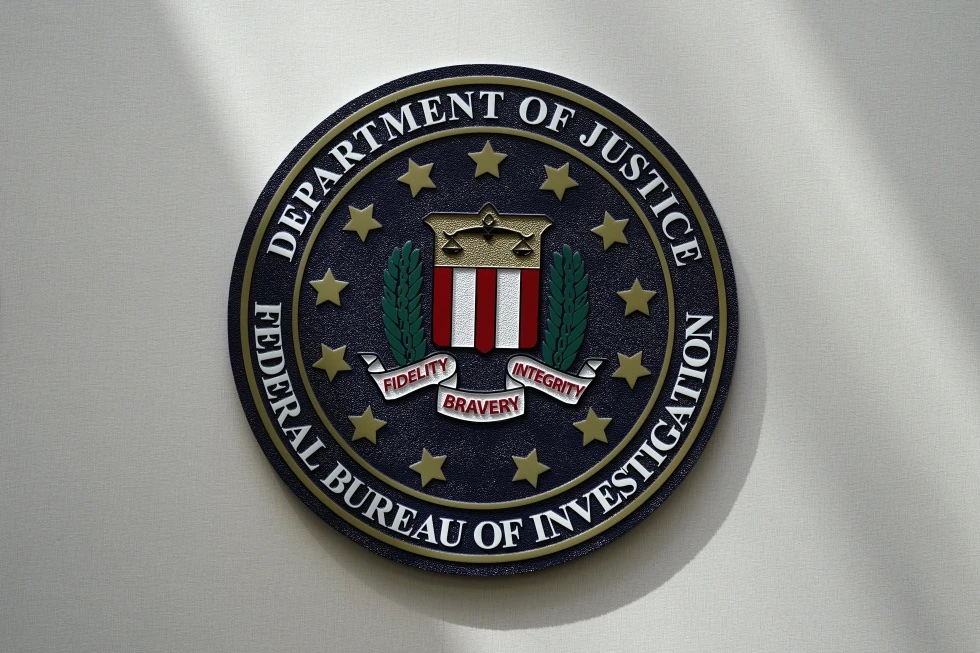 An FBI seal is seen on a wall on Aug. 10, 2022, in Omaha, Neb. Violent crime in the US dropped again in 2023, according to FBI statistics that show a continued trend downward after a coronavirus pandemic-era crime spike. The report released Monday shows overall violent crime ticked down an estimated 3% in 2023 from the year before, according to the FBI.