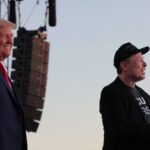 Tesla CEO and X owner Elon Musk speaks as Republican presidential nominee and former U.S. president Donald Trump looks on during a campaign rally, at the site of the July assassination attempt against Trump, in Butler, Pennsylvania, U.S., October 5, 2024.