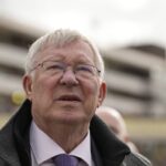 Former Manchester United manager Alex Ferguson, watches a large TV screen during The County Hurdle race as his horse L’Eau Du Sud came in second place behind Absurde, during the final day of the Cheltenham Festival at Cheltenham Racecourse, England, Friday, March 15, 2024.