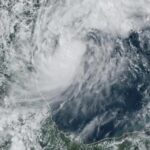 This GOES-16 GeoColor satellite image taken at 4:50 p.m. EDT and provided by National Oceanic and Atmospheric Administration (NOAA) shows Tropical Storm Milton, center, off the coast of Mexico in the Gulf of Mexico, Saturday, Oct. 5, 2024.