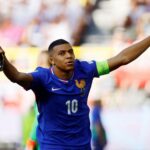 France's Kylian Mbappe celebrates scoring their first goal