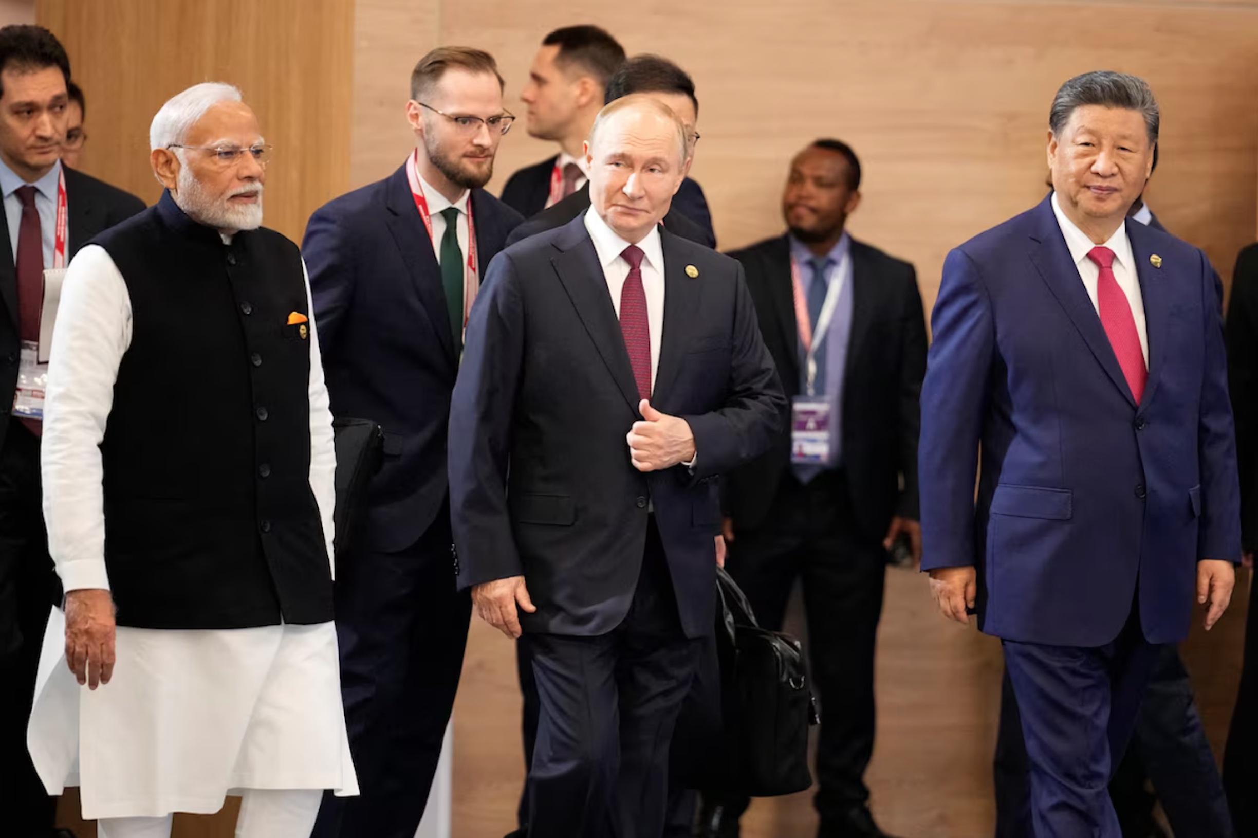 Indian Prime Minister Narendra Modi, Russian President Vladimir Putin and Chinese President Xi Jinping attend a family photo ceremony prior to the BRICS Summit plenary session in Kazan, Russia, Wednesday, Oct. 23, 2024. 