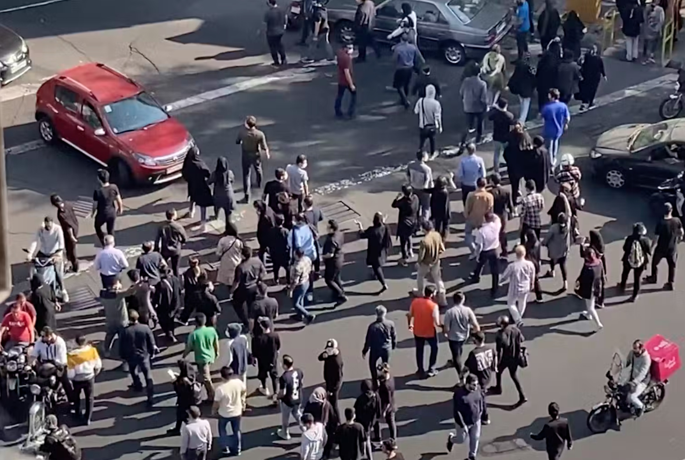 People blocking an intersection in Iran during a protest against Mahsa Amini’s death in custody in 2022. AP