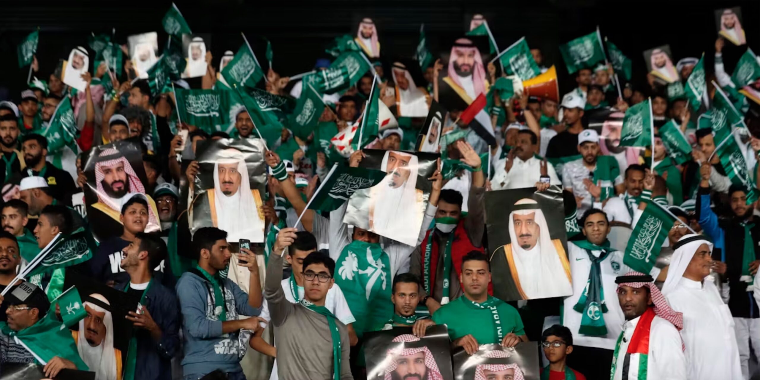 Saudi fans hold pictures of Saudi Arabia’s King Salman and Saudi Crown Prince Mohammed bin Salman ahead of the AFC Asian Cup group E soccer match between Saudi Arabia and Qatar in Abu Dhabi, United Arab Emirates, in January 2018.