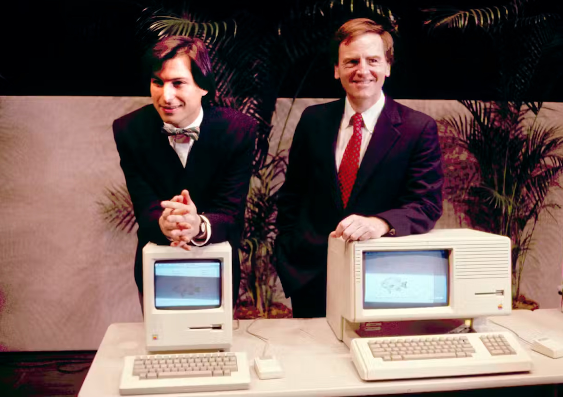 Former Apple CEO Steven P. Jobs, left and President John Sculley presenting the new Macintosh Desktop Computer in January 1984 at a shareholder meeting in Cupertino, Calif. 