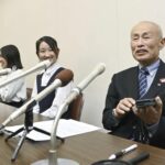 Toshiyuki Mimaki, right, president of Nihon Hidankyo, or the Japan Confederation of A- and H-Bomb Sufferers Organizations, speaks to media members in Hiroshima, Japan, Friday, Oct. 11, 2024, as he reacts to Ninon Hidankyo’s winning the Nobel Peace Prize.