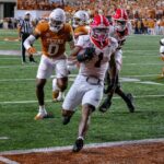 Georgia running back Trevor Etienne (1) runs into the end zone for a touchdown against Texas during the first half of an NCAA college football game in Austin, Texas, Saturday, Oct. 19, 2024.