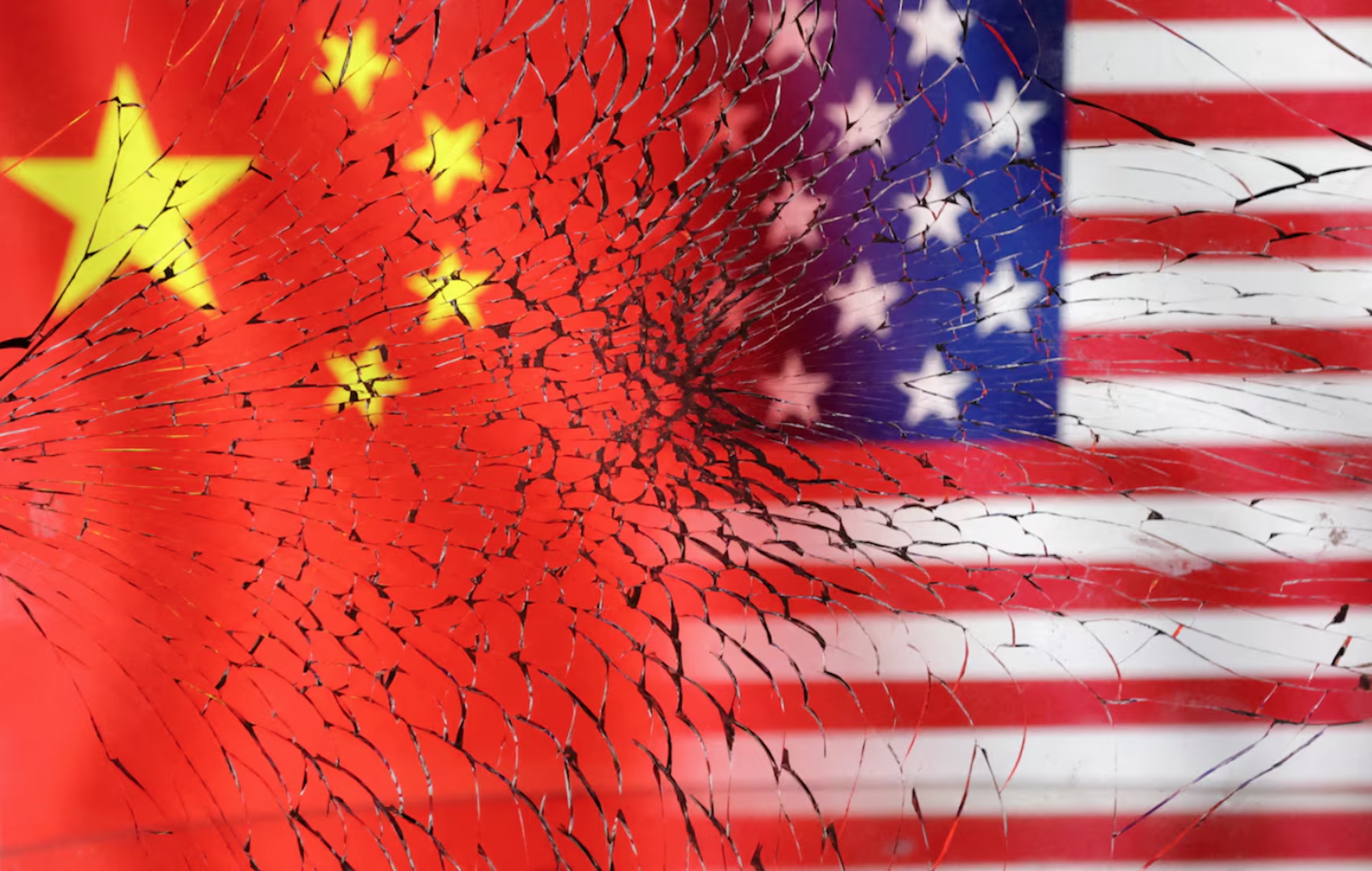 U.S. and Chinese flags are seen through broken glass in this illustration taken, January 30, 2023. 