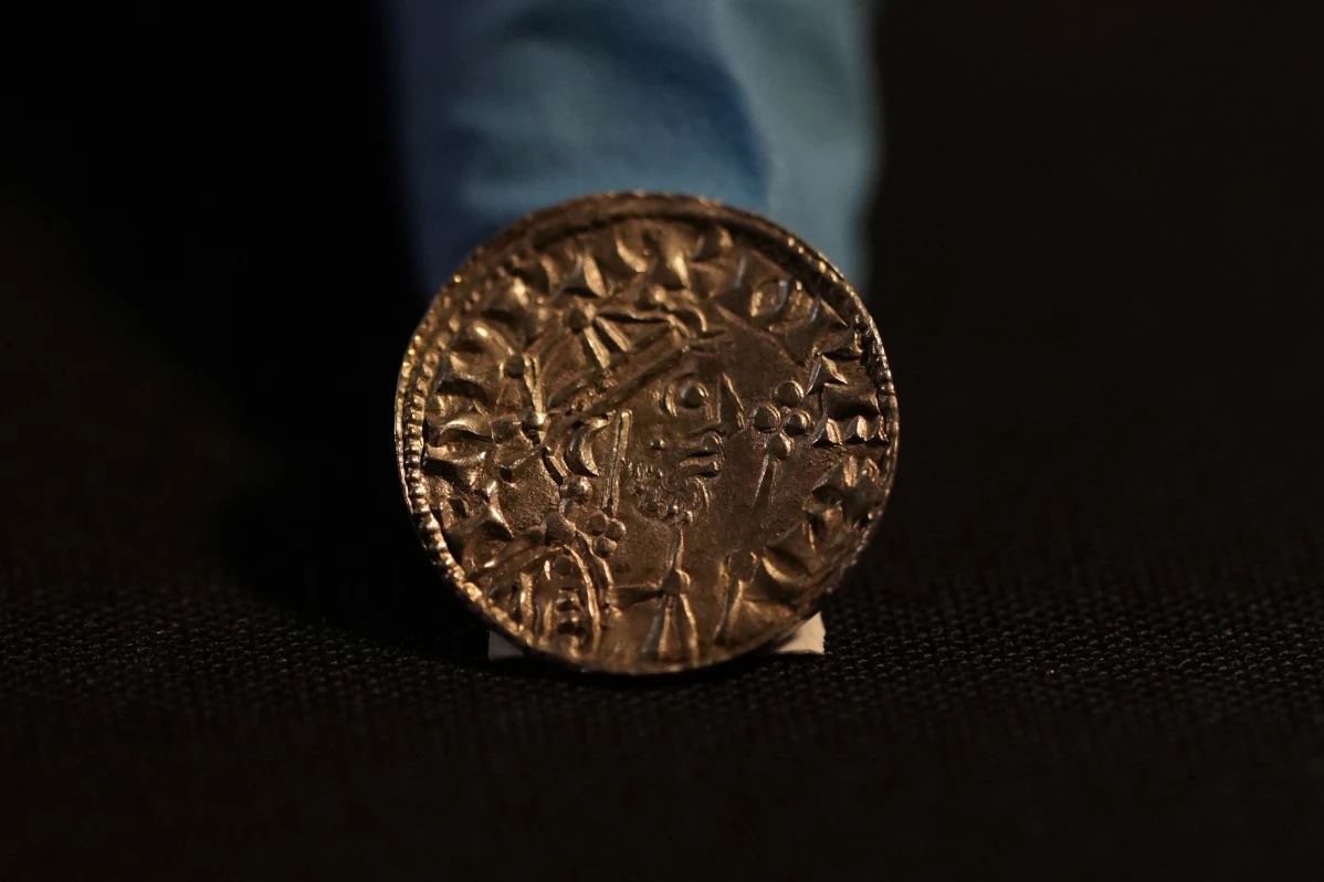 An Edward the Confessor Pyramid coin (1065-6), part of the Chew Valley Hoard of 2,584 coins, buried in the turmoil following the Norman Invasion of Britain in 1066, on display at the British Museum in London, Tuesday, Oct. 22, 2024, the hoard is valued at £4.3 million pounds, (US.58 million), a record find. 