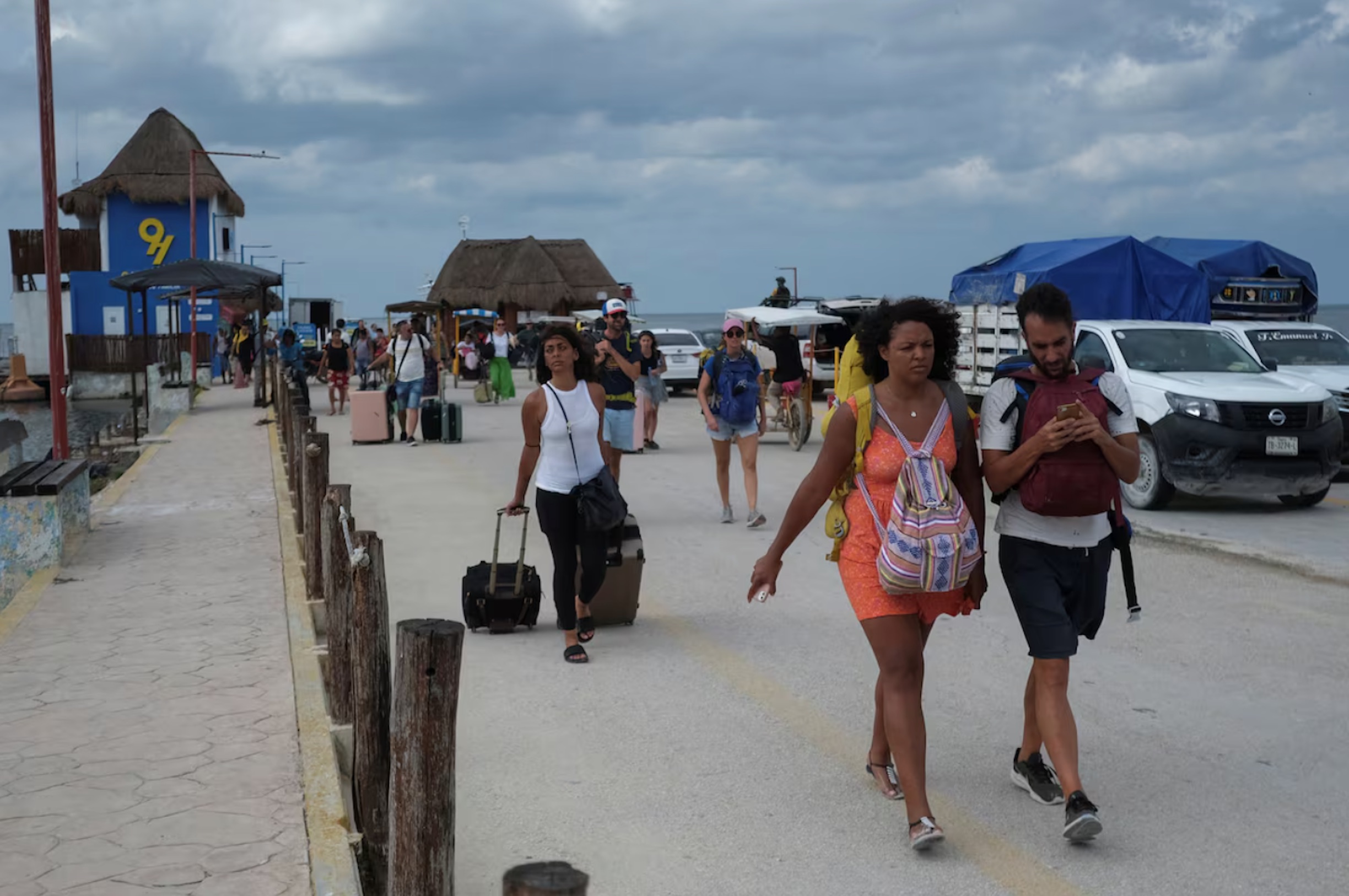 Residents and tourists heed a voluntary evacuation call as Hurricane Milton advances, on the island of Holbox, Mexico, October 7, 2024. 