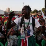 A supporter of Senegal's Prime Minister and the head of the ruling Pastef party Ousmane Sonko reacts as he attends a campaign rally for the upcoming early legislative election, in Guediawaye on the outskirts of Dakar, Senegal, November 13, 2024.