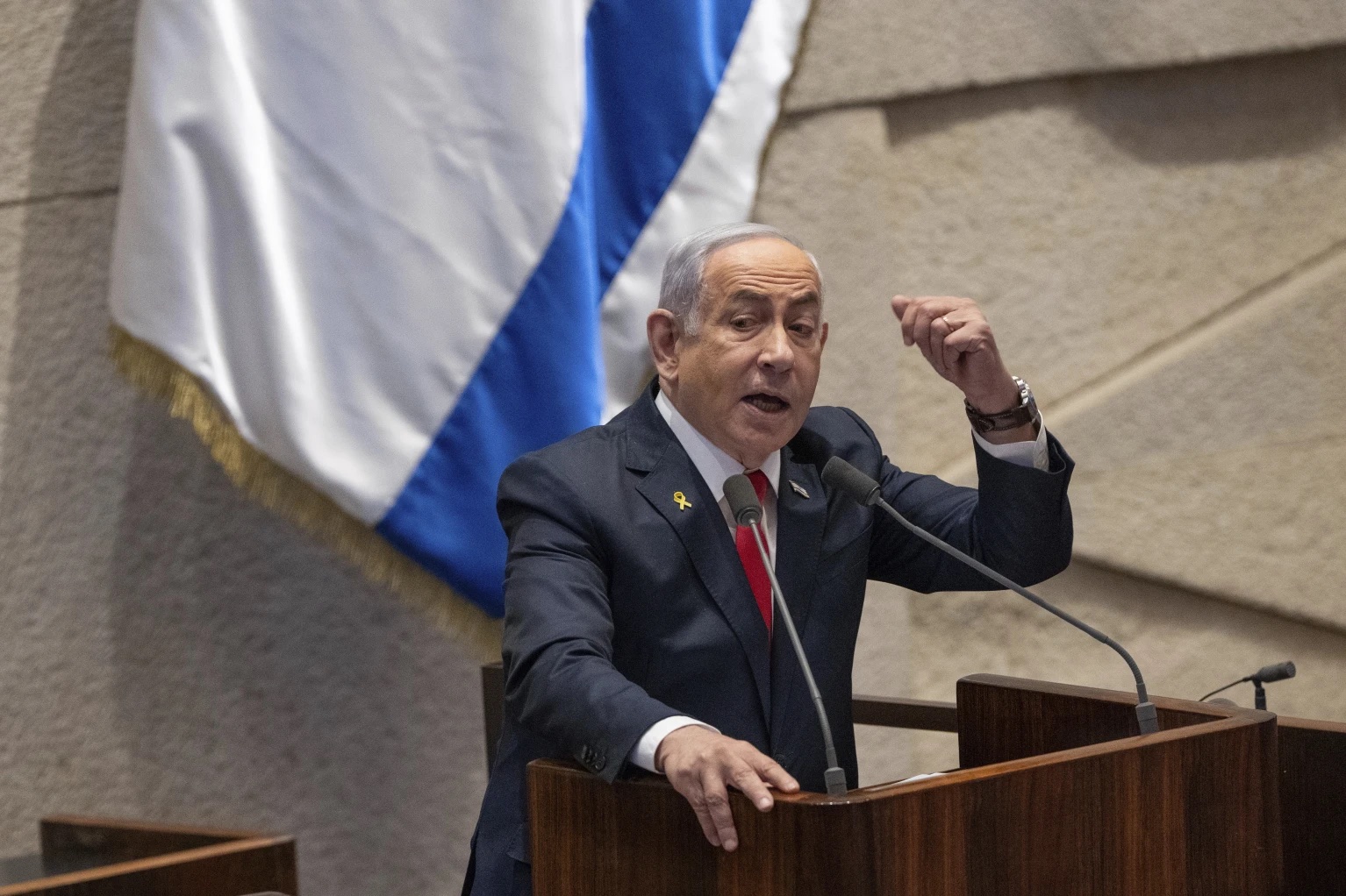 FILE - Israel’s Prime Minister Benjamin Netanyahu addresses lawmakers in the Knesset, Israel’s parliament, in Jerusalem. Monday Nov. 18, 2024.