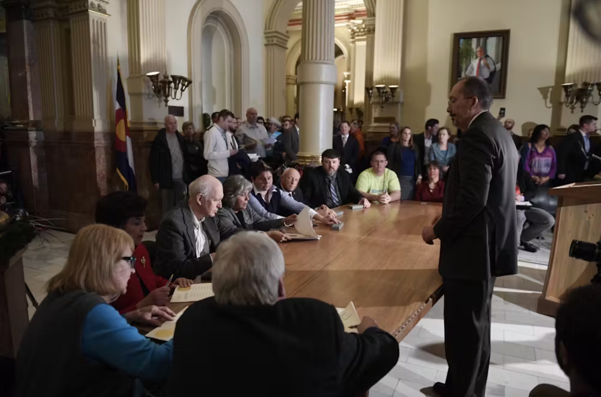 Colorado’s electors sign their Certificate of Vote, Dec. 19, 2016, in Denver. 