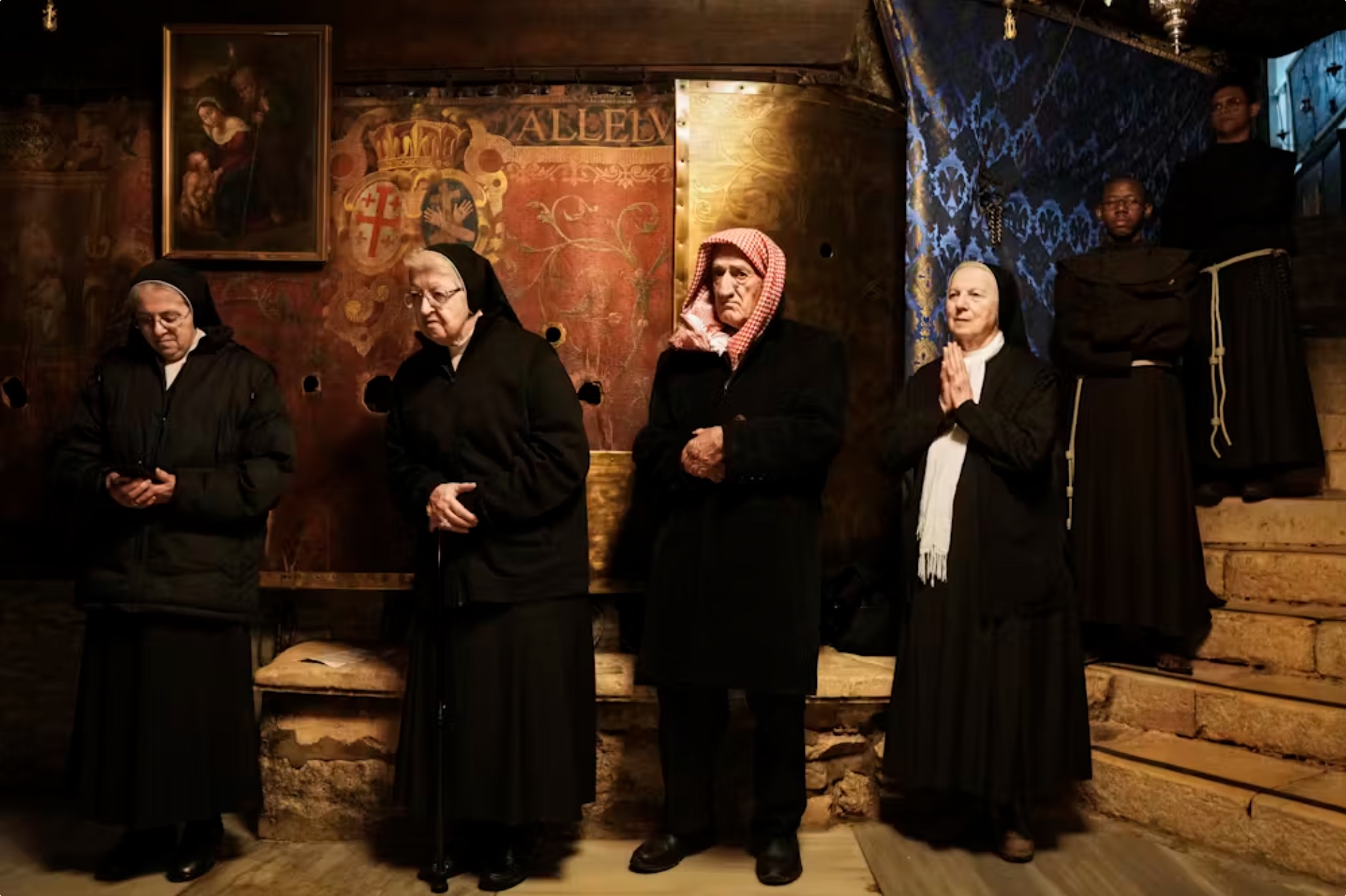 Christian worshippers pray at the Grotto under the Church of the Nativity, traditionally believed to be the birthplace of Jesus, on Christmas Day in the West Bank city of Bethlehem. 