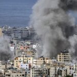 Smoke rises after an Israeli airstrike on Dahiyeh, in the southern suburb of Beirut, Lebanon, Monday, Nov. 25, 2024.