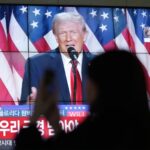 A viewer in Seoul, South Korea, watches Donald Trump declare victory in the 2024 US presidential election.