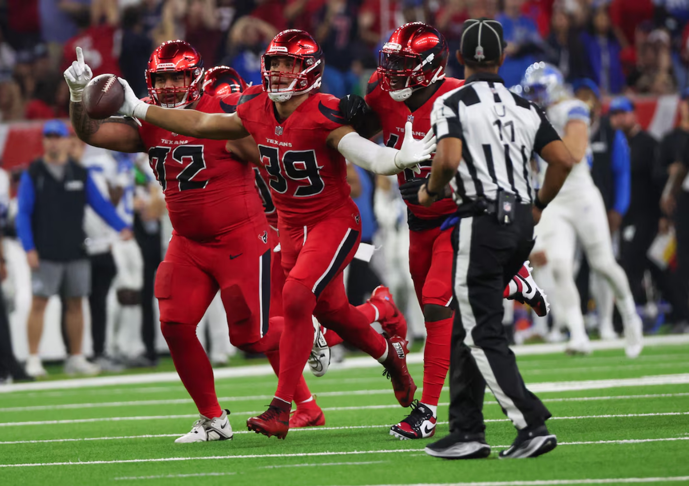 Houston Texans linebacker Henry To'oTo'o (39) celebrates his interception with teammates against the Detroit Lions in the second quarter at NRG Stadium.