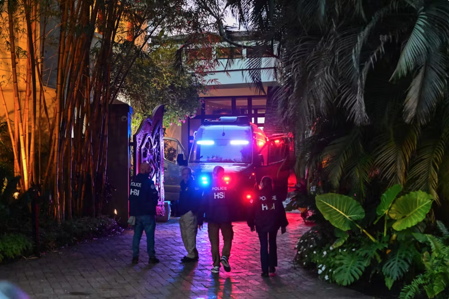 Homeland Security Investigation agents are seen at the entrance of Sean Combs’ Miami Beach, Fla., home on March 24, 2024. 