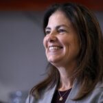 Republican gubernatorial candidate Kelly Ayotte, who faces Democrat Joyce Craig in the November 2024 election, smiles during a visit to a local concrete coating business, Wednesday, Oct. 16, 2024, in Manchester, N.H.