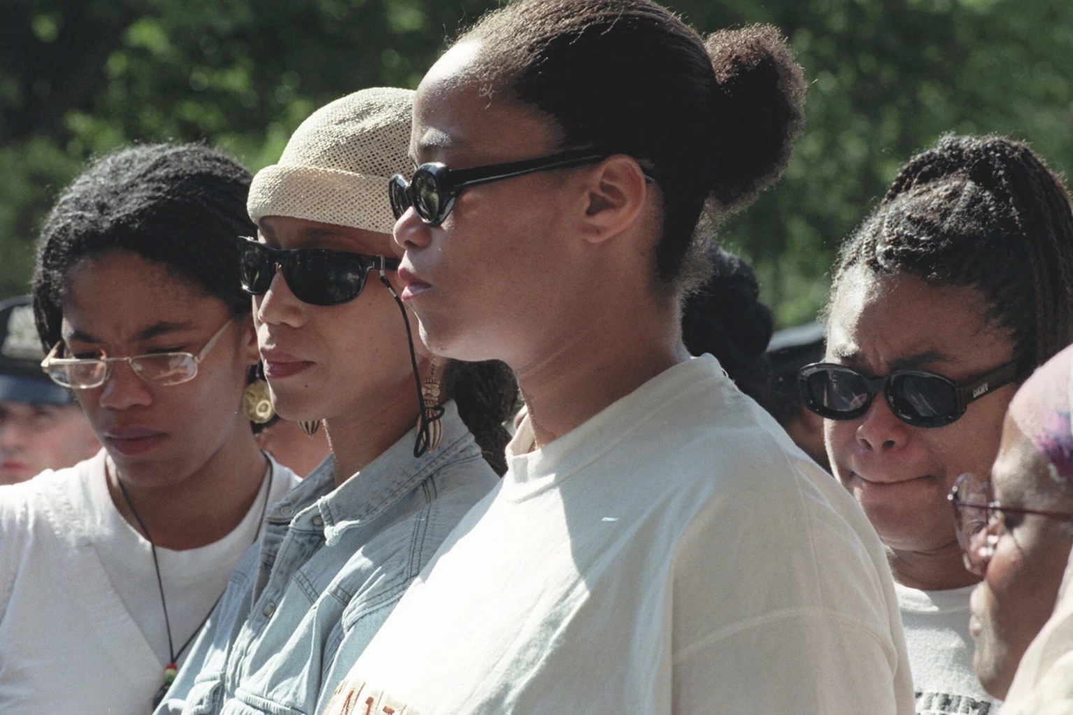 Malcolm X’s daughters Malikah Shabazz, left, Attallah Shabazz, second from left, Malaak Shabazz, third from left, and Gamilah Shabazz, talk to the media outside the Jacobi Medical Center in the Bronx borough of New York, following the death of their mother, Betty Shabazz, June 23, 1997. 