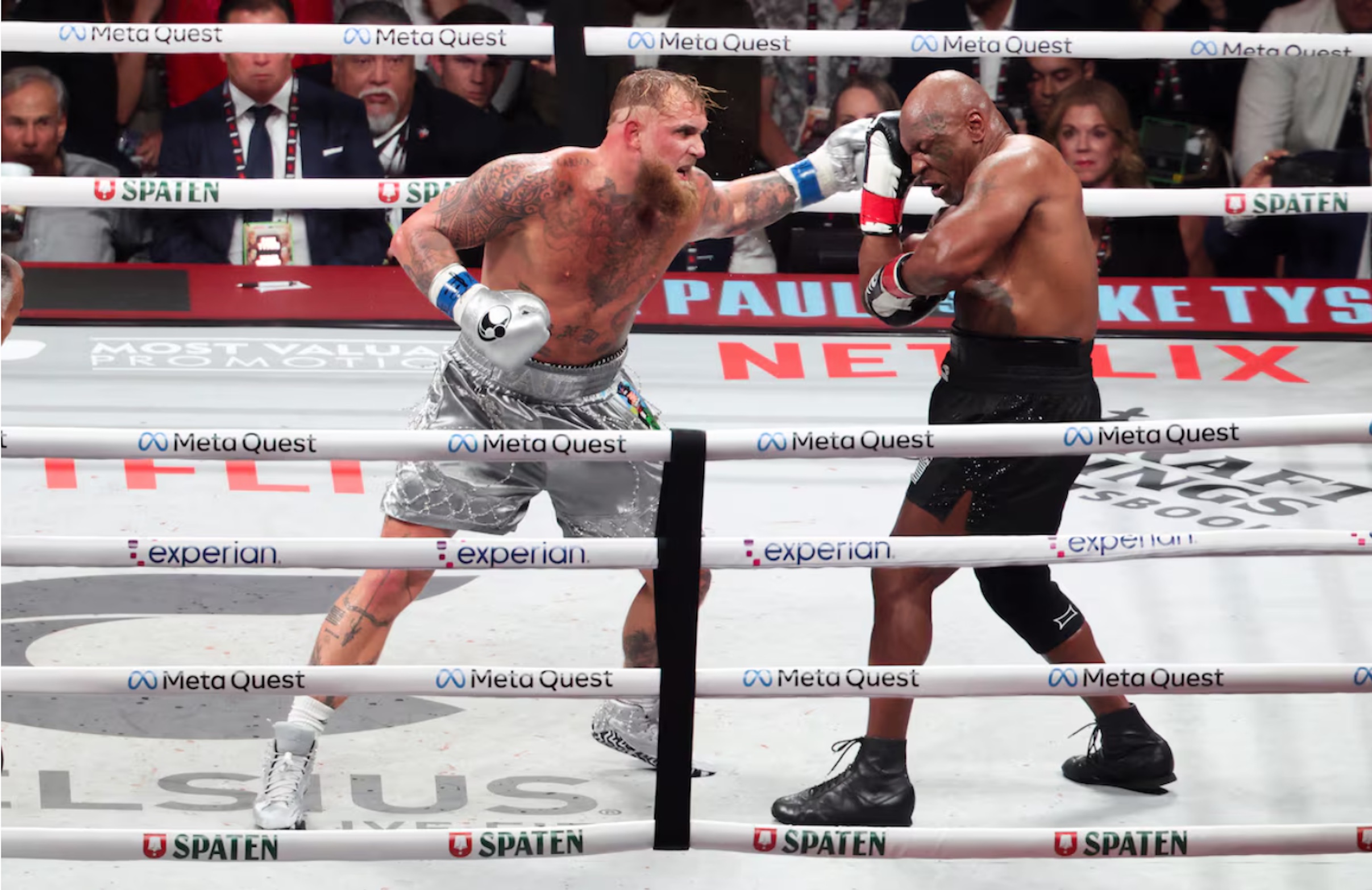 Nov 15, 2024; Arlington, Texas, UNITED STATES; Mike Tyson (black gloves) fights Jake Paul (silver gloves) at AT&T Stadium. 