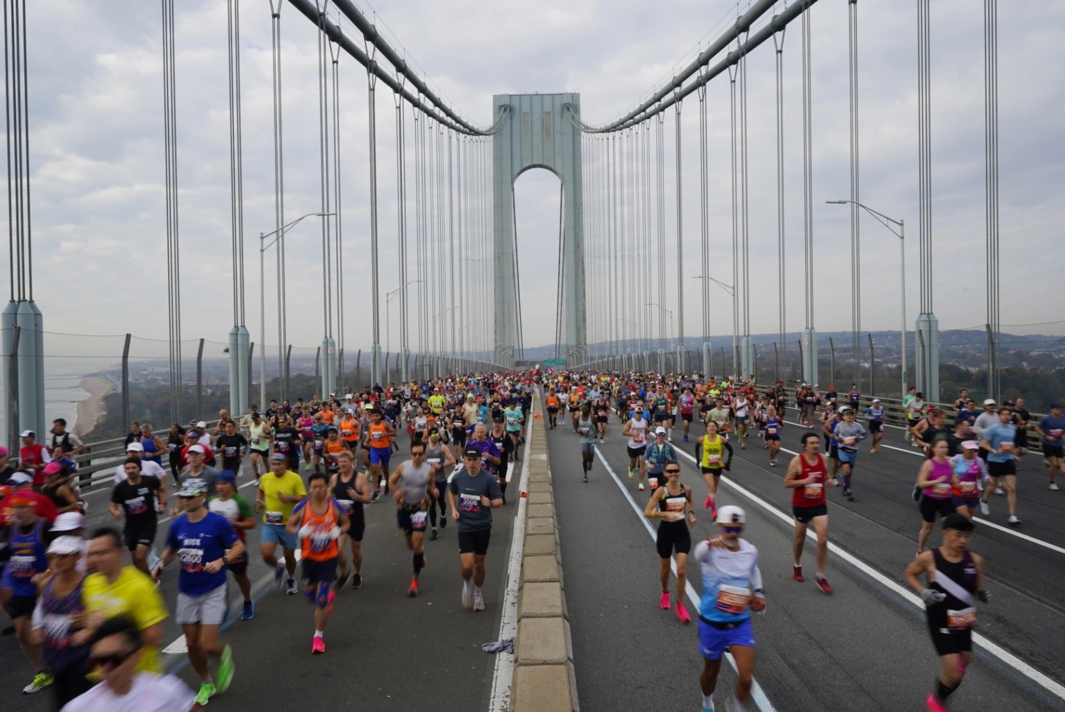 Runners cross the Verrazzano-Narrows Bridge at the start of the New York City Marathon, in New York, Sunday, Nov. 5, 2023.