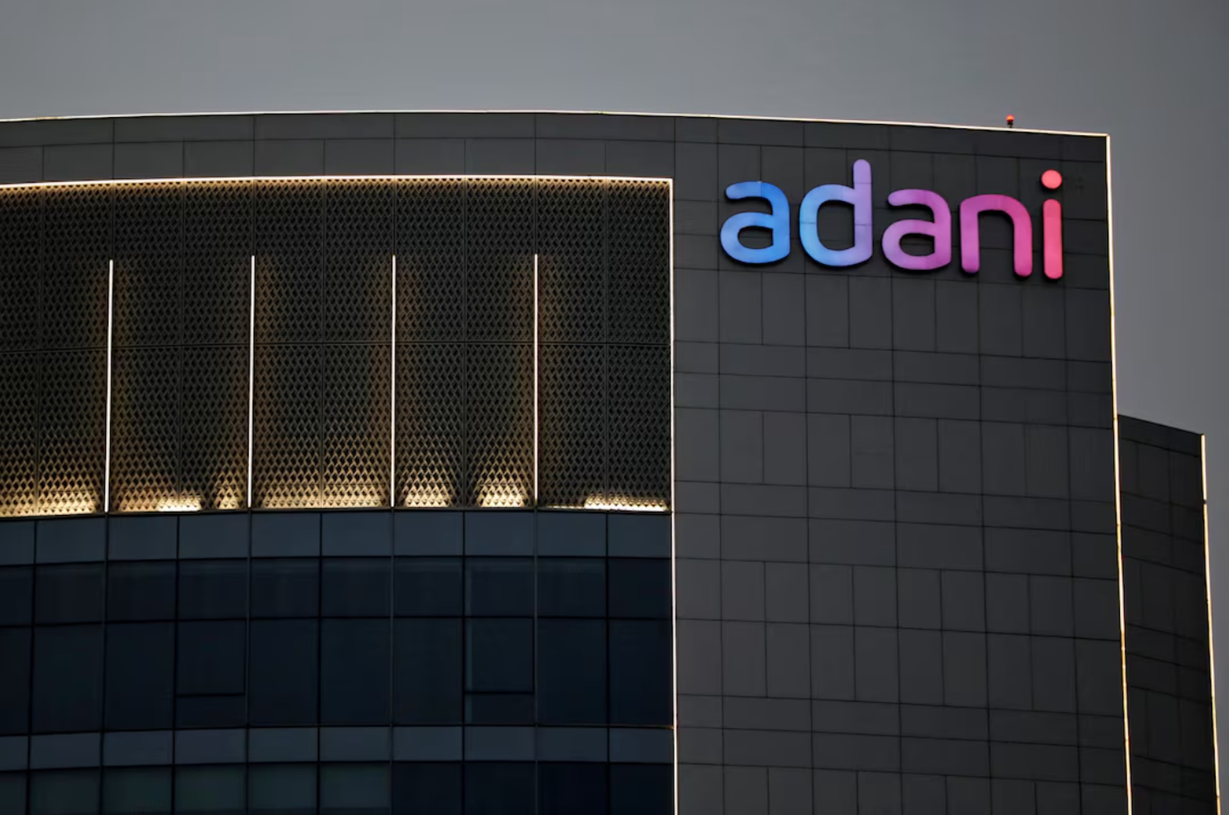 The logo of the Adani Group is seen on the facade of one of its buildings on the outskirts of Ahmedabad, India, April 13, 2021. 