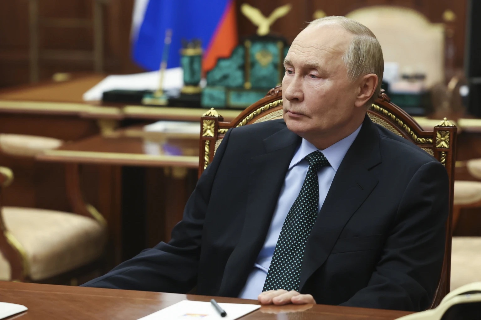 Russian President Vladimir Putin listens to Moscow-appointed head of Russian-controlled Zaporizhzhia region of Ukraine, Yevgeny Balitsky during their meeting at the Kremlin in Moscow, Russia, Monday, Nov. 18, 2024.