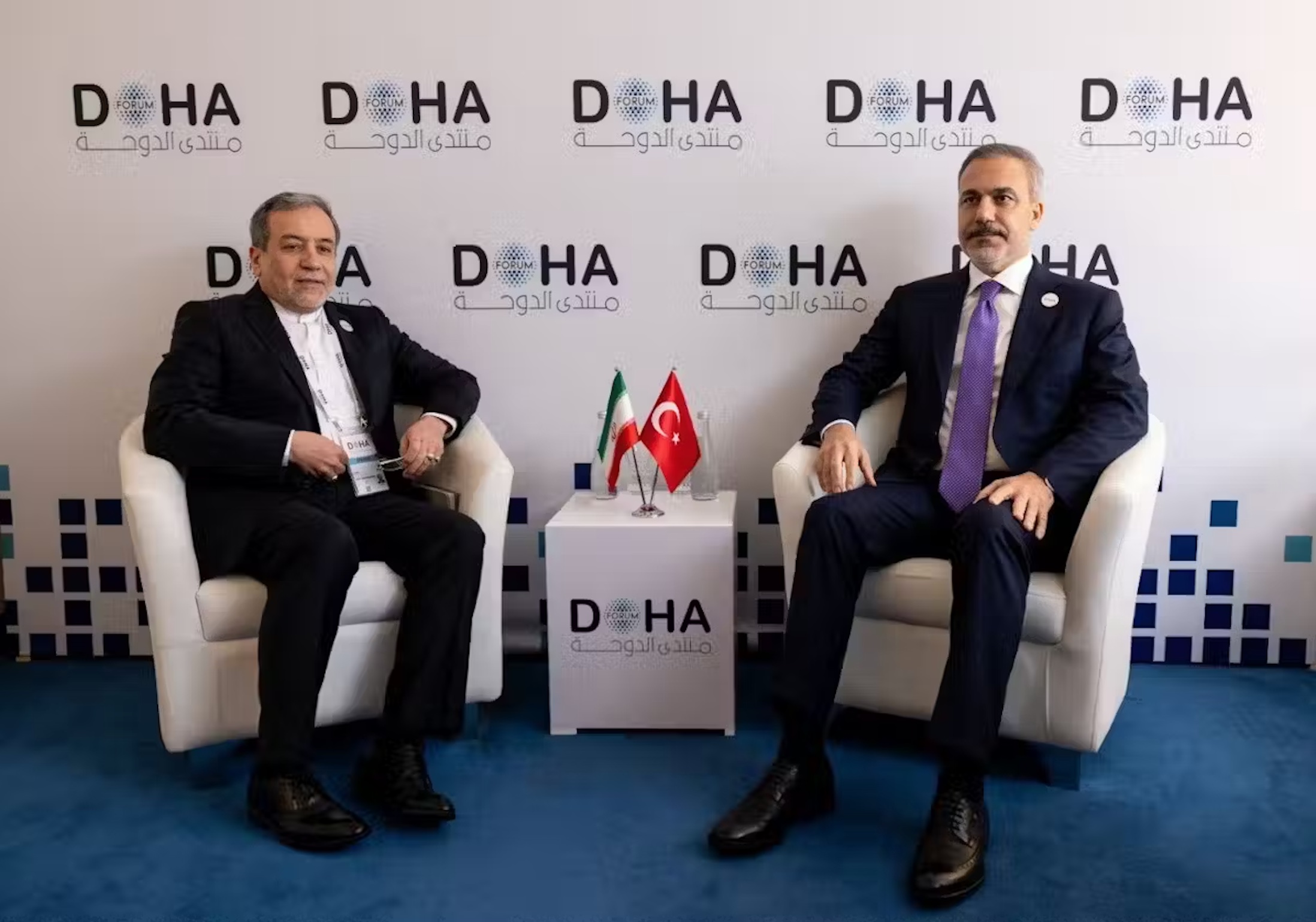 Iranian Foreign Minister Abbas Araghchi (left) meets with Turkish counterpart Hakan Fidan to dicuss the Syrian crisis in Doha, Qatar, on December 7. 