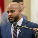 Assembly member Isaac Bryan, D-Los Angeles, speaks on a bill at the Capitol in Sacramento, Calif., Sept. 12, 2023.