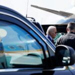 U.S. President Joe Biden gets out of a vehicle, before he boards Air Force One en route to Angola, at Amilcar Cabral International Airport in Sal, Cape Verde, December 2, 2024.