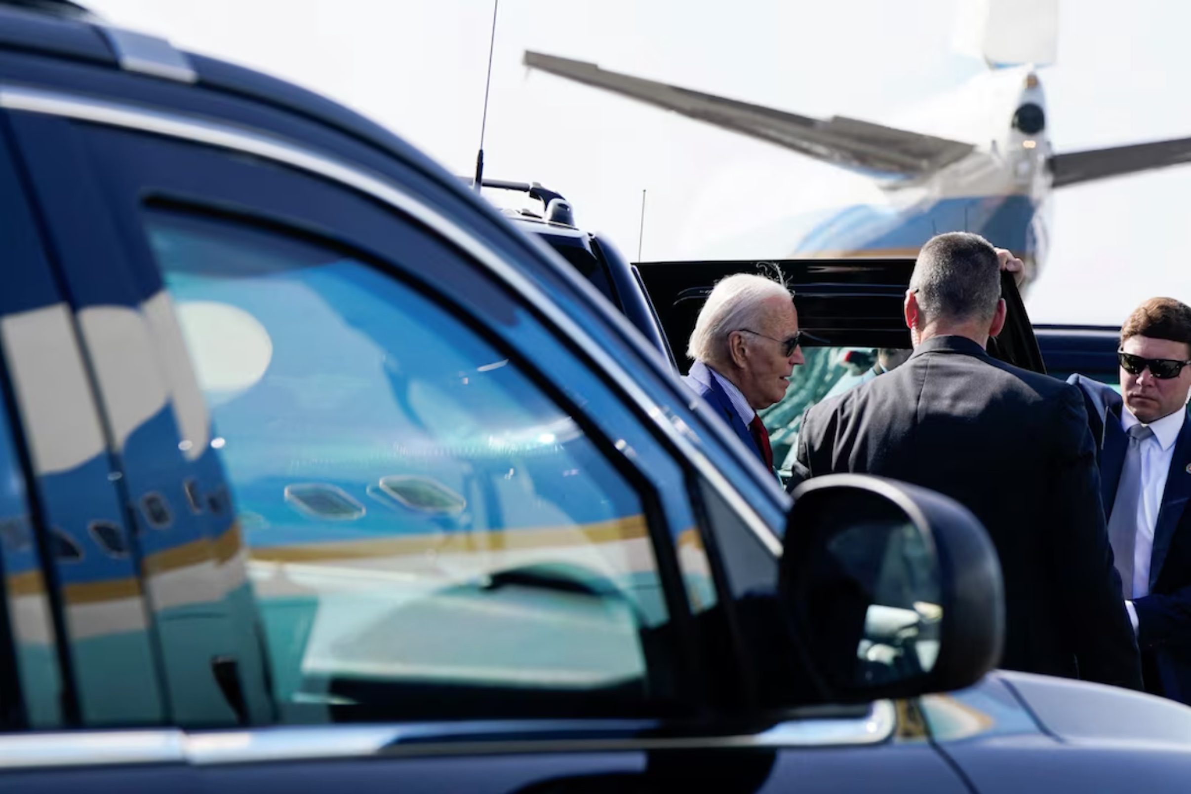 U.S. President Joe Biden gets out of a vehicle, before he boards Air Force One en route to Angola, at Amilcar Cabral International Airport in Sal, Cape Verde, December 2, 2024. 