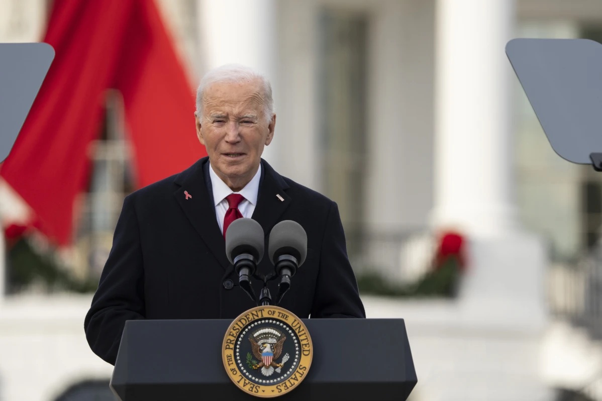 President Joe Biden speaks on the South Lawn of the White House during a ceremony to commemorate World AIDS Day with survivors, their families and advocates, Sunday, Dec. 1, 2024, in Washington.