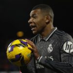 Real Madrid’s Kylian Mbappe holds the ball during a Spanish La Liga soccer match between Girona and Real Madrid at the Montilivi stadium in Girona, Spain, Saturday, Dec. 7, 2024.