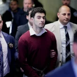 Luigi Mangione, the suspect in the killing of UnitedHealth Group executive Brian Thompson, walks on the day of an arraignment hearing, at New York Supreme Court in New York City, U.S. December 23, 2024.