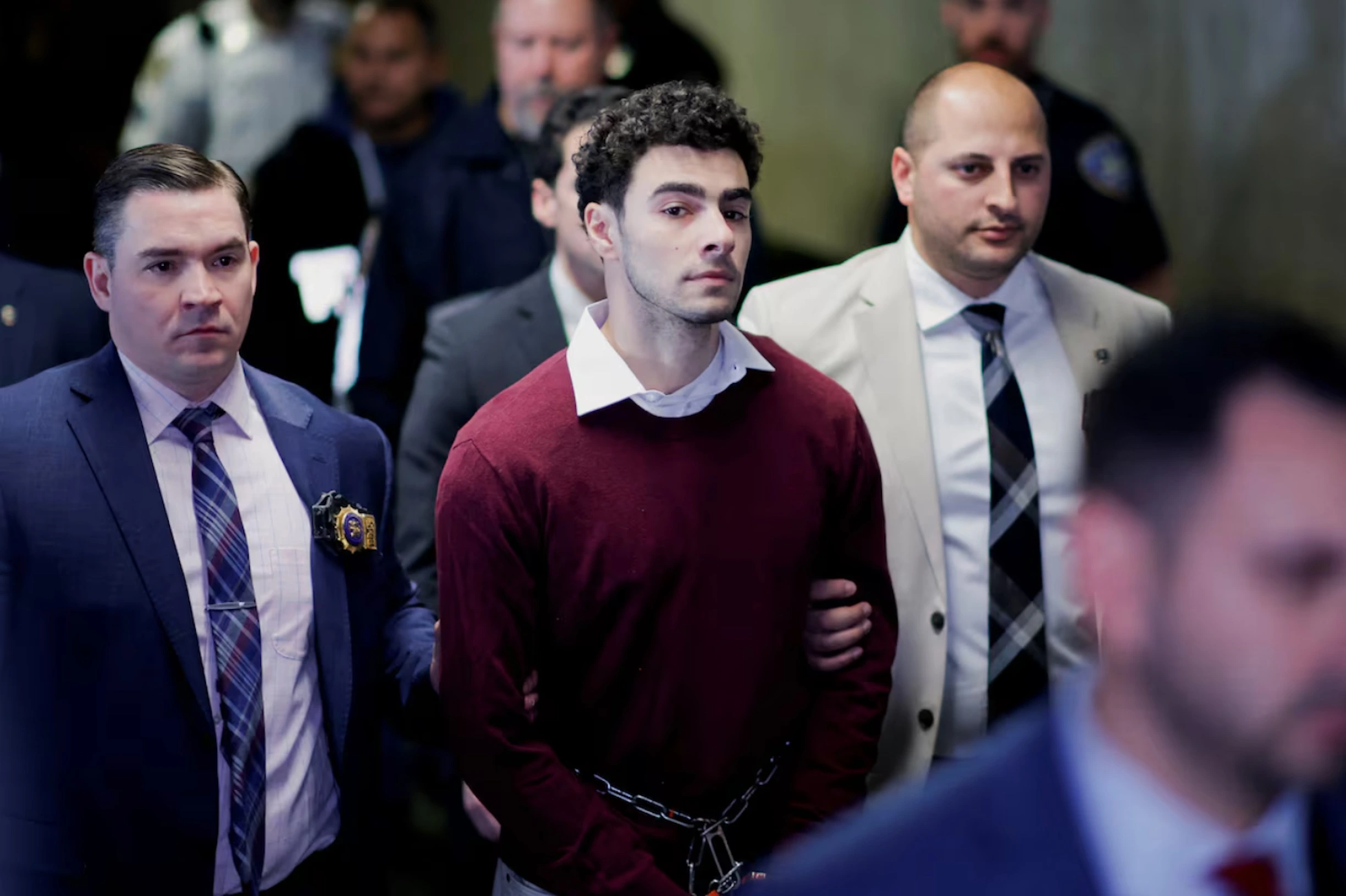 Luigi Mangione, the suspect in the killing of UnitedHealth Group executive Brian Thompson, walks on the day of an arraignment hearing, at New York Supreme Court in New York City, U.S. December 23, 2024. 