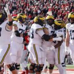 Michigan players celebrate their touchdown against Ohio State during the first half of an NCAA college football game Saturday, Nov. 30, 2024, in Columbus, Ohio.