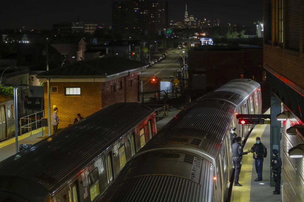 New York Police officers clear a train at the Coney Island Stillwell Avenue Terminal, May 5, 2020, in the Brooklyn borough of New York.