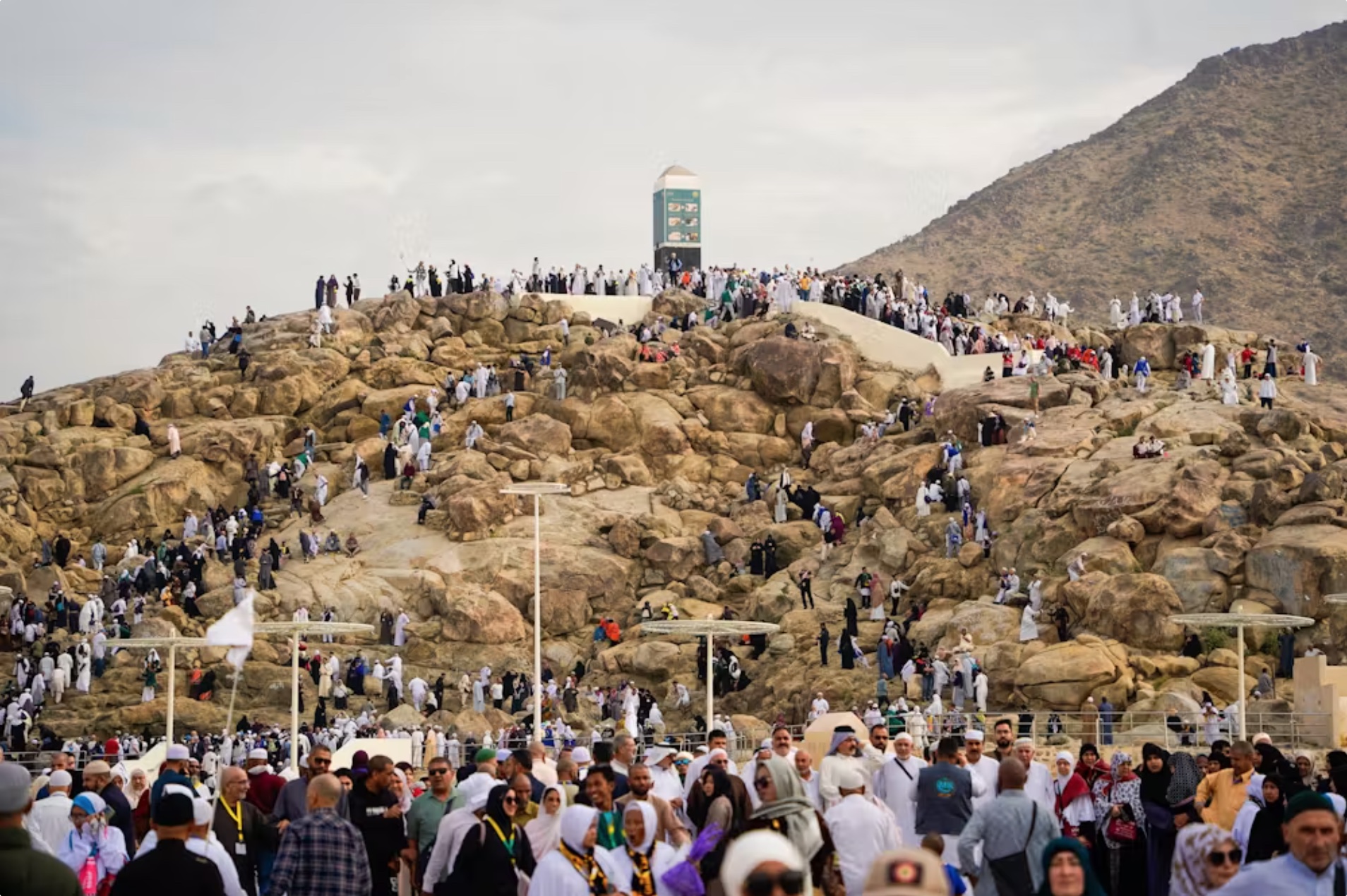 Pilgrims walk six to 21 kilometres a day during the Hajj, often in extreme conditions. Pictured: pilgrims climbing Jabal Rahmah/Mount Arafat in 2024. 