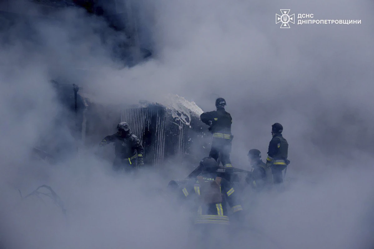 In this image provided by the Ukrainian Emergency Service, firefighters put out the fire following a Russian missile attack on the country’s energy system in Dnipropetrovsk region, Ukraine, Wednesday, Dec. 25, 2024.