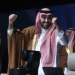 Saudi sports minister Abdulaziz bin Turki al-Faisal al-Saud celebrates the news.