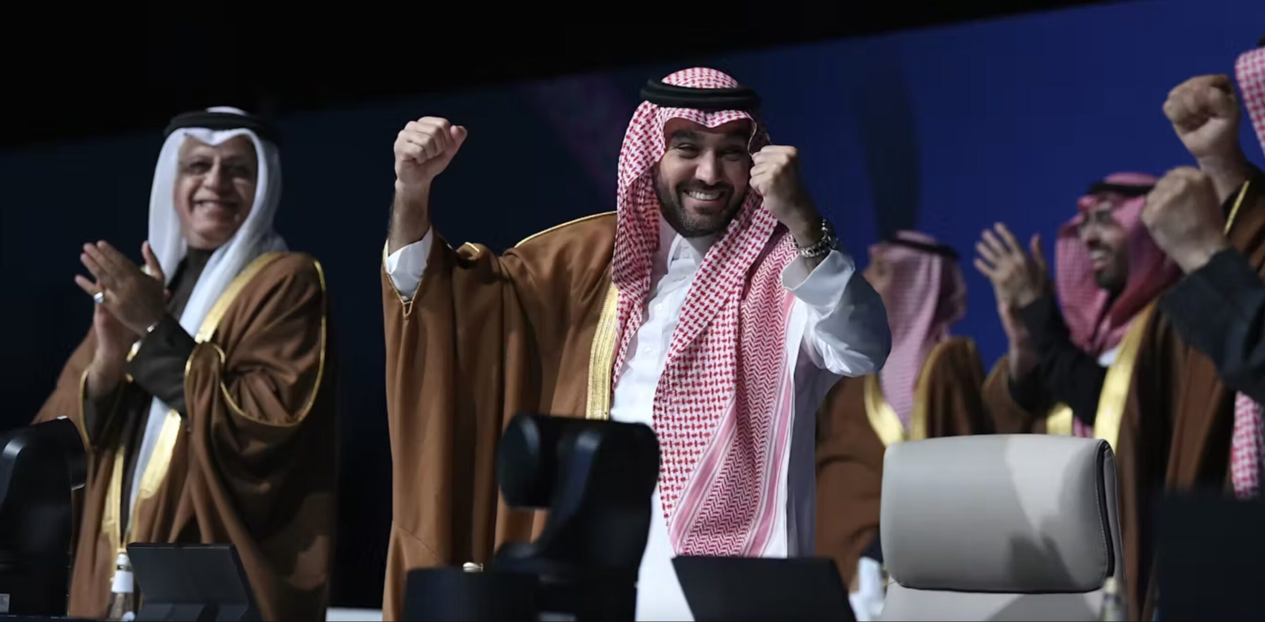 Saudi sports minister Abdulaziz bin Turki al-Faisal al-Saud celebrates the news. 