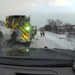 This still image provided by Kalamazoo County Sheriff’s Office shows police dashcam footage of snow storm crash involving emergency vehicles on Thursday, Dec. 12, 2024 in Kalamazoo County, Mich.