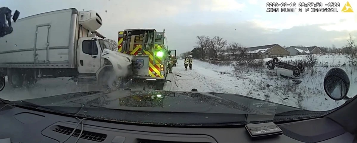 This still image provided by Kalamazoo County Sheriff’s Office shows police dashcam footage of snow storm crash involving emergency vehicles on Thursday, Dec. 12, 2024 in Kalamazoo County, Mich. 