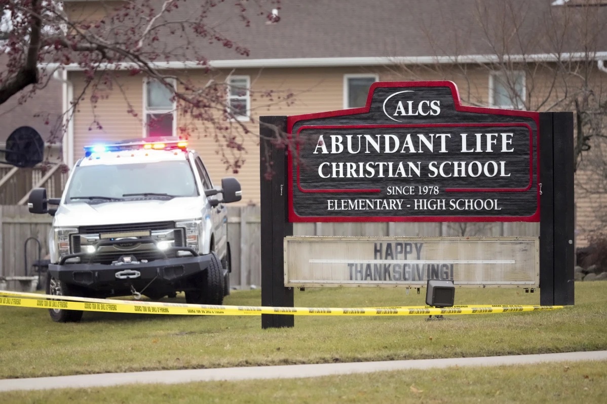 Emergency vehicles are parked outside the Abundant Life Christian School in Madison, Wis., following a shooting, Monday, Dec. 16, 2024. 