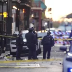 Emergency services attend the scene on Bourbon Street after a vehicle drove into a crowd on New Orleans’ Canal and Bourbon Street, Wednesday Jan. 1, 2025.