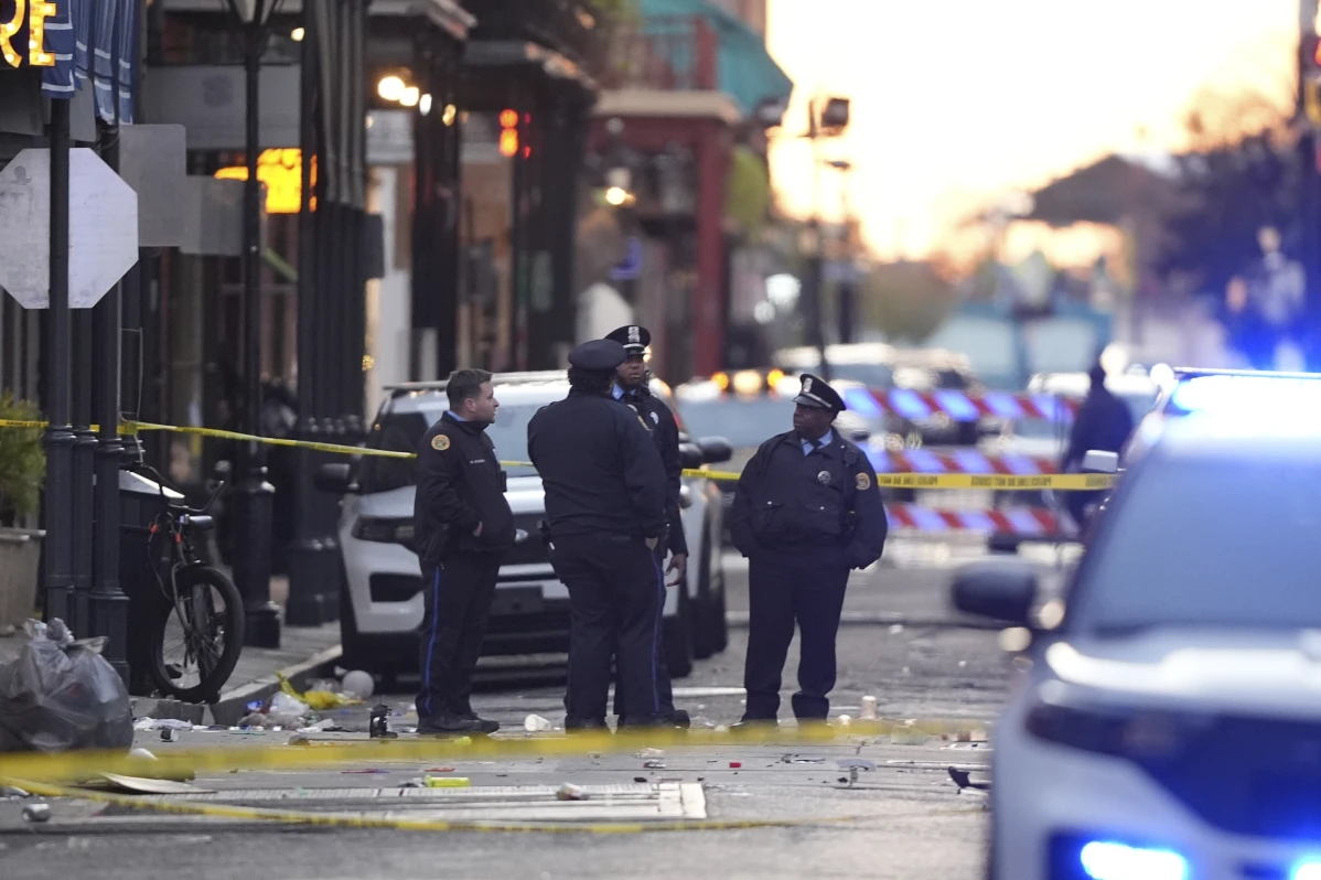 Emergency services attend the scene on Bourbon Street after a vehicle drove into a crowd on New Orleans’ Canal and Bourbon Street, Wednesday Jan. 1, 2025. 