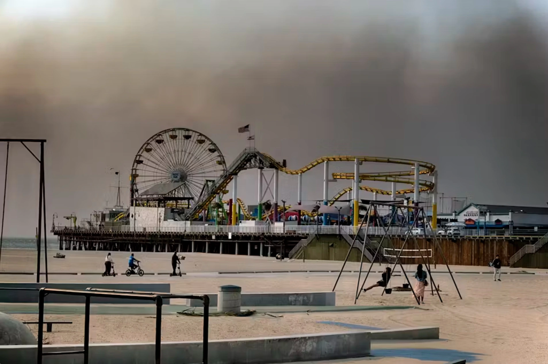 Dark smoke from the fires was evident from the Santa Monica, Calif., pier on Jan. 8, 2025. 